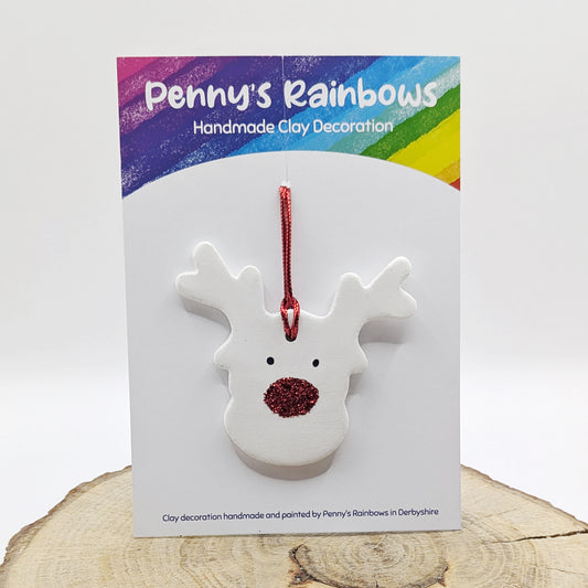 Whiteclay reindeer decoration with red glitter nose on a Penny's Rainbows  card