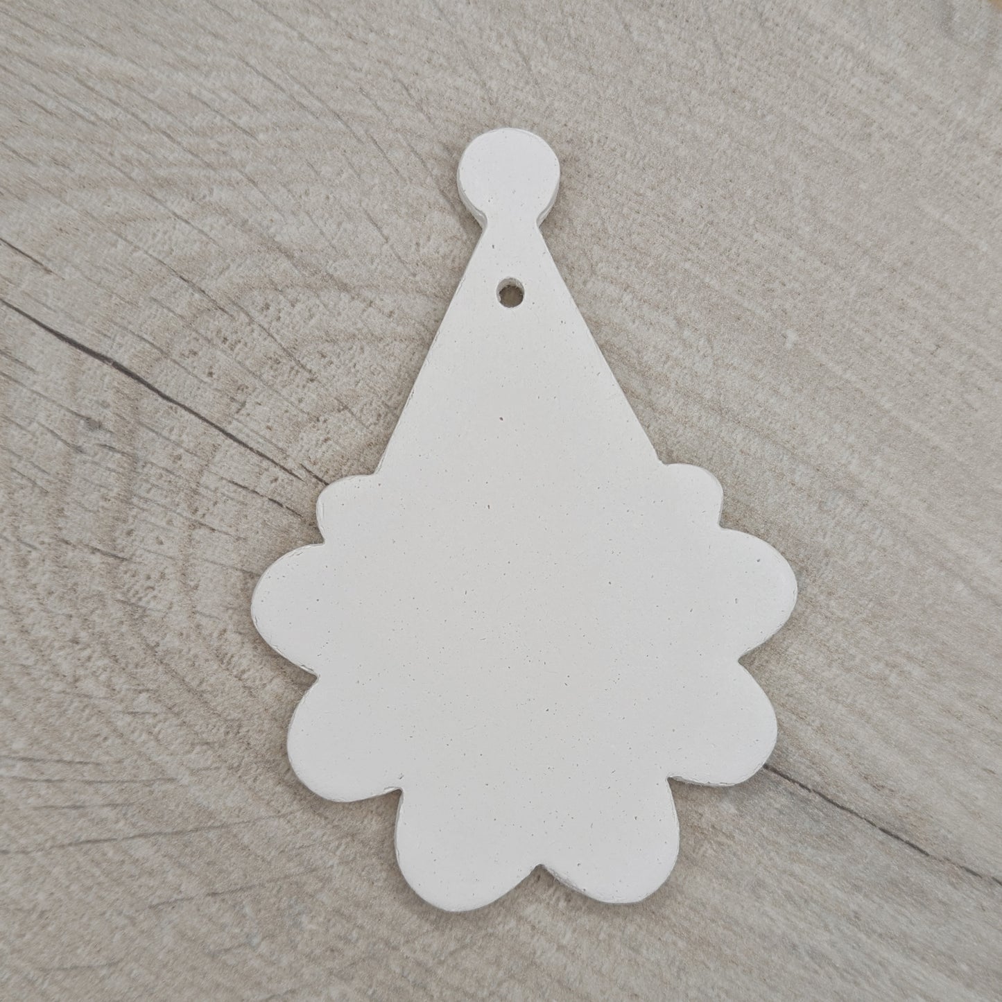 santa face and hat shaped clay decoration