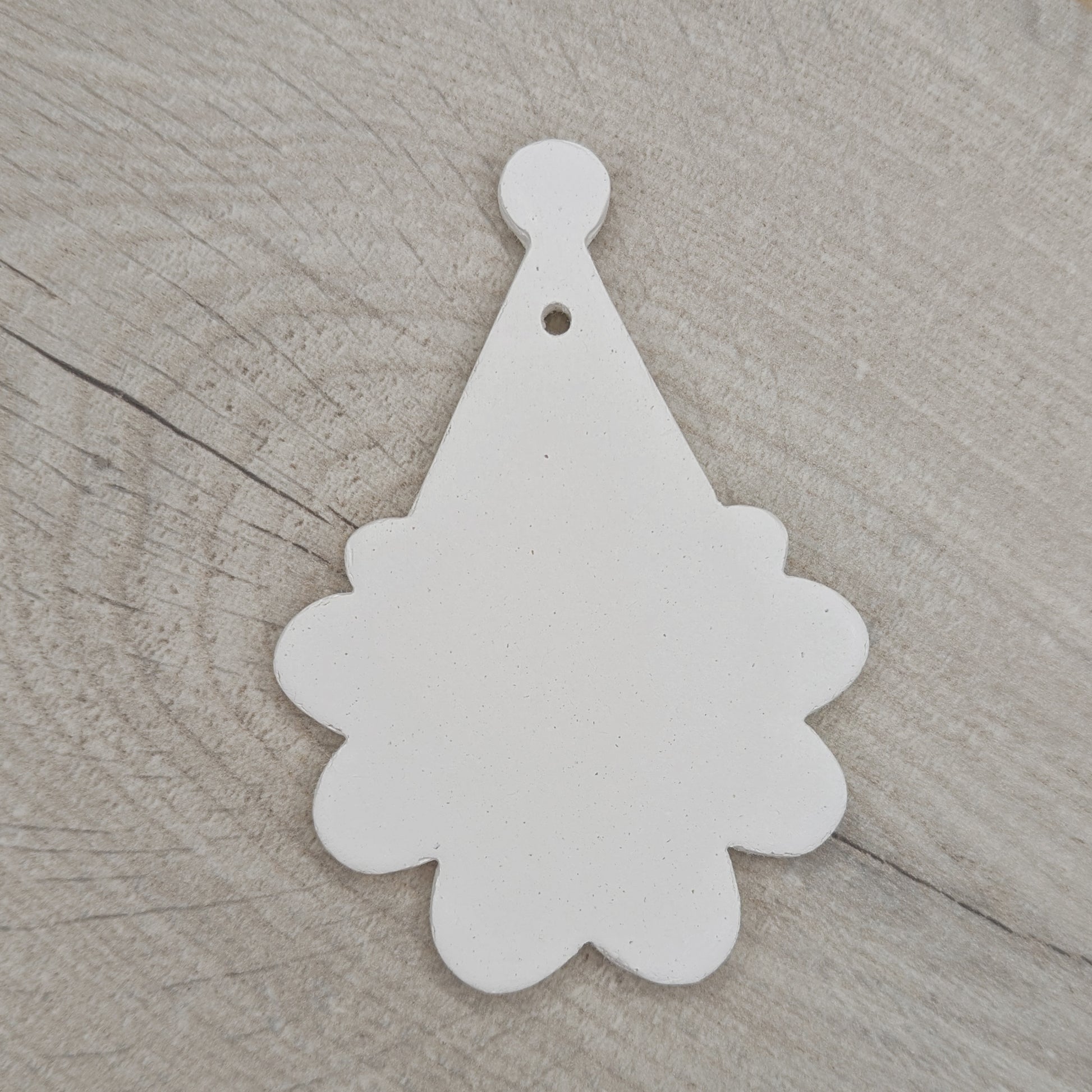 santa face and hat shaped clay decoration