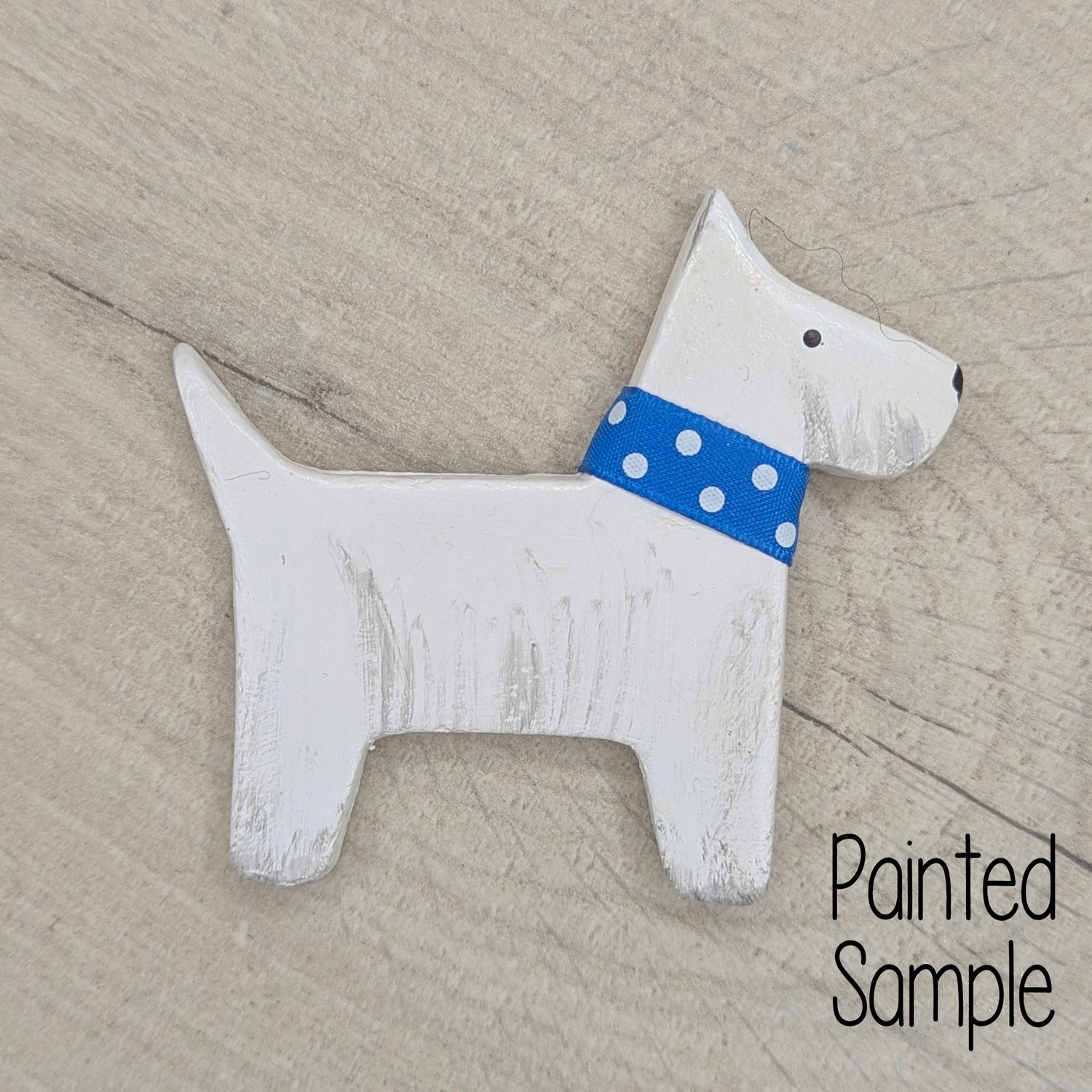 white scotty dog with blue colour on 