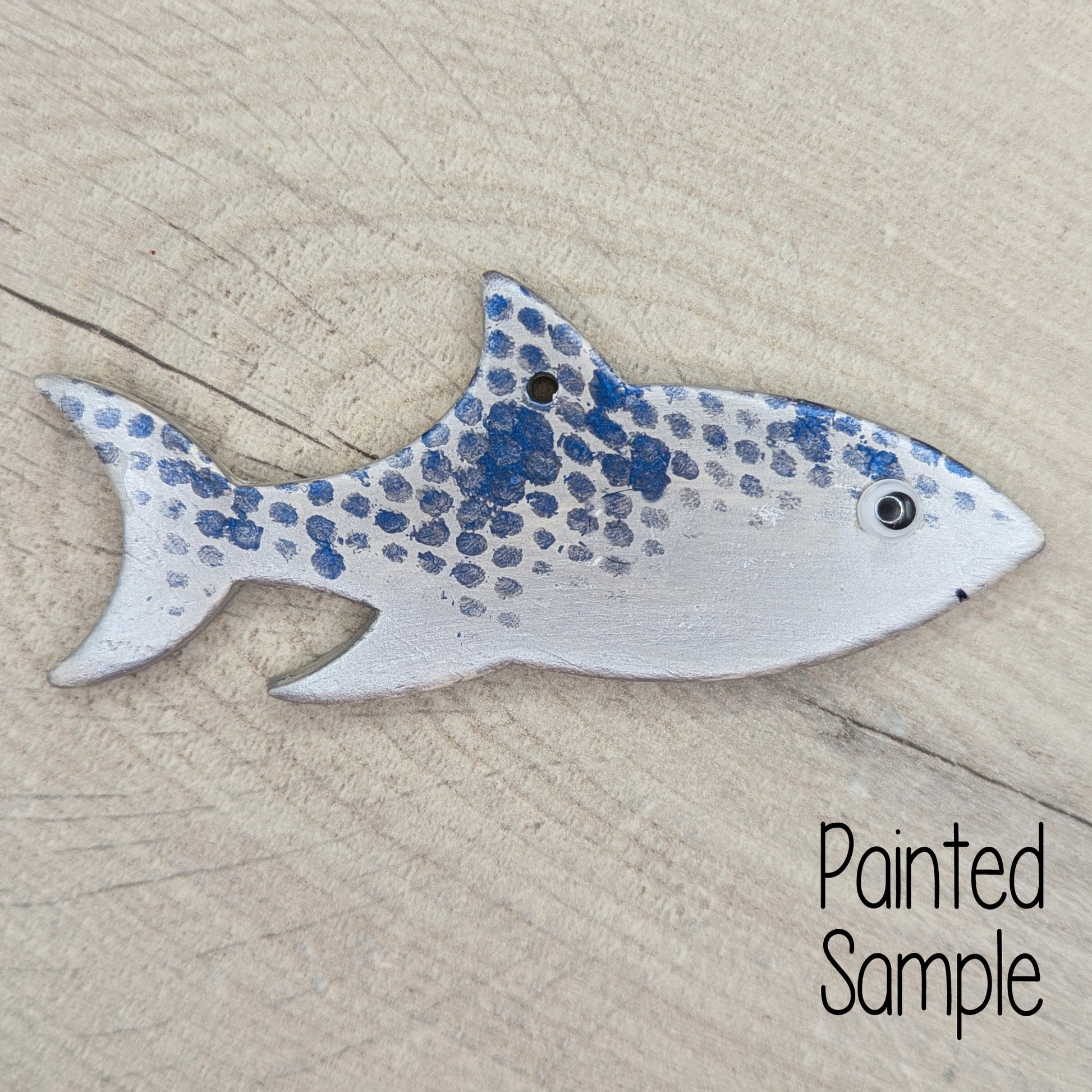 painted shark clay decoration, painted in silver grey with blue scales and boggle eyes