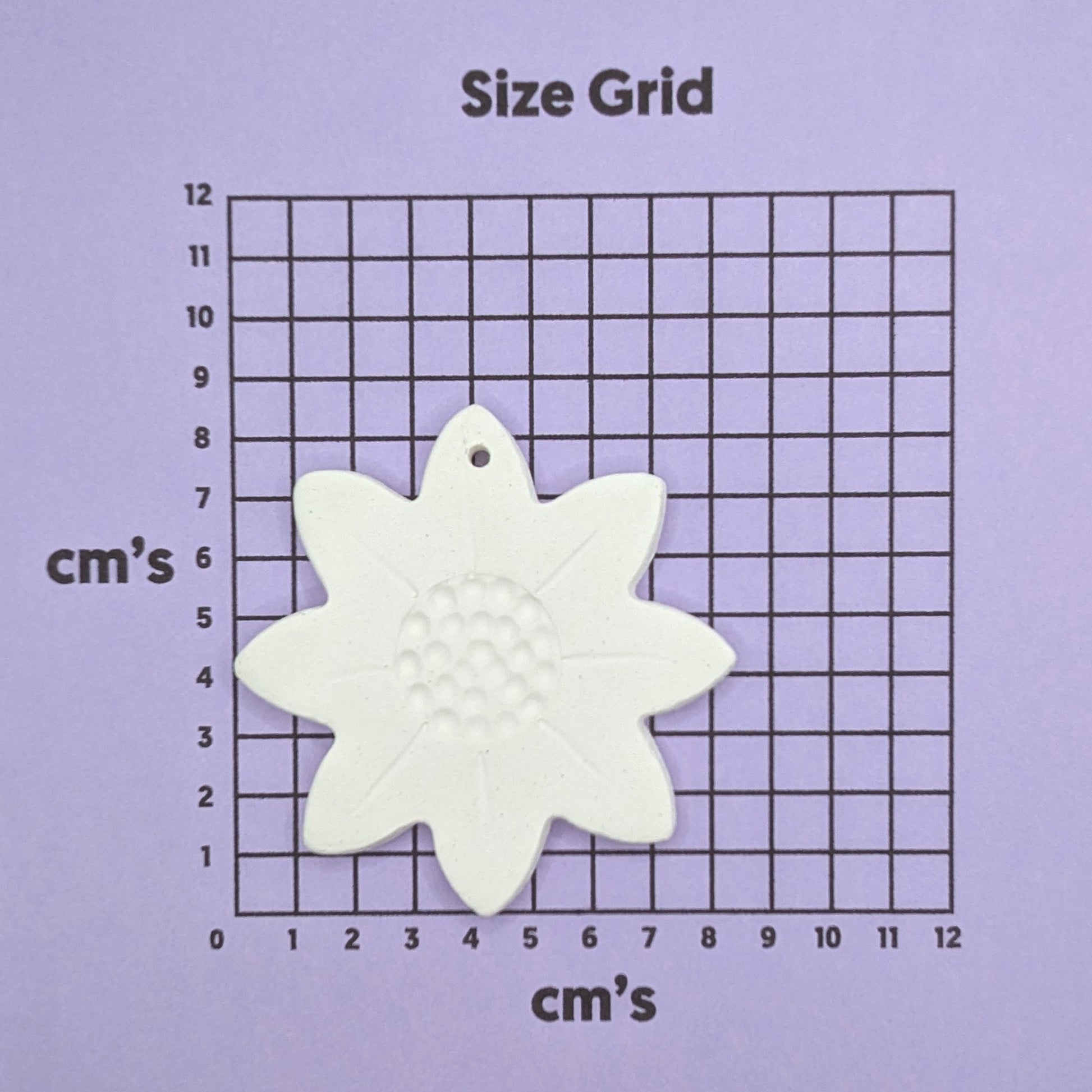 sunflower clay decoration shown on size chart