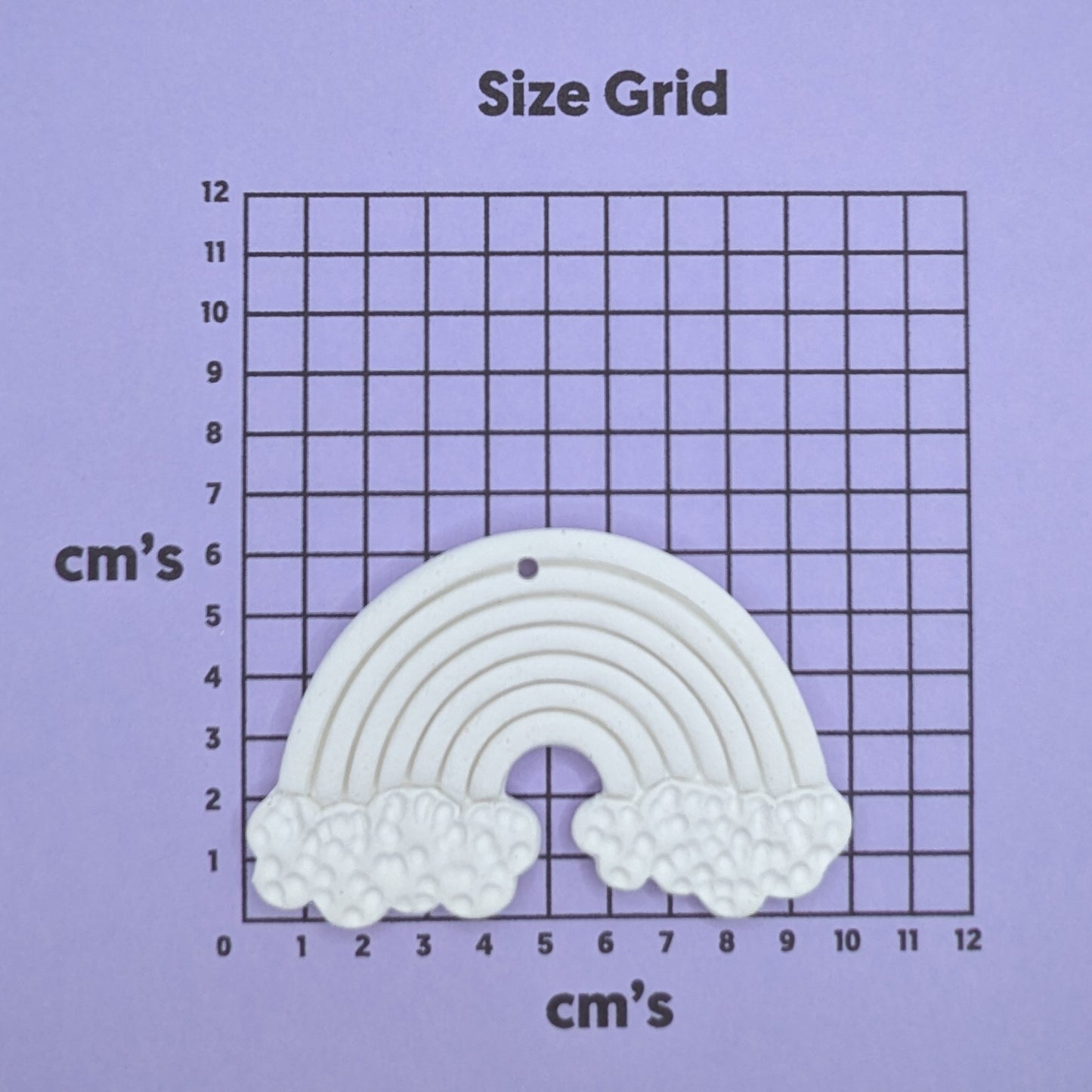 clay rainbow decoration on a size grid with measurements in centimeters 