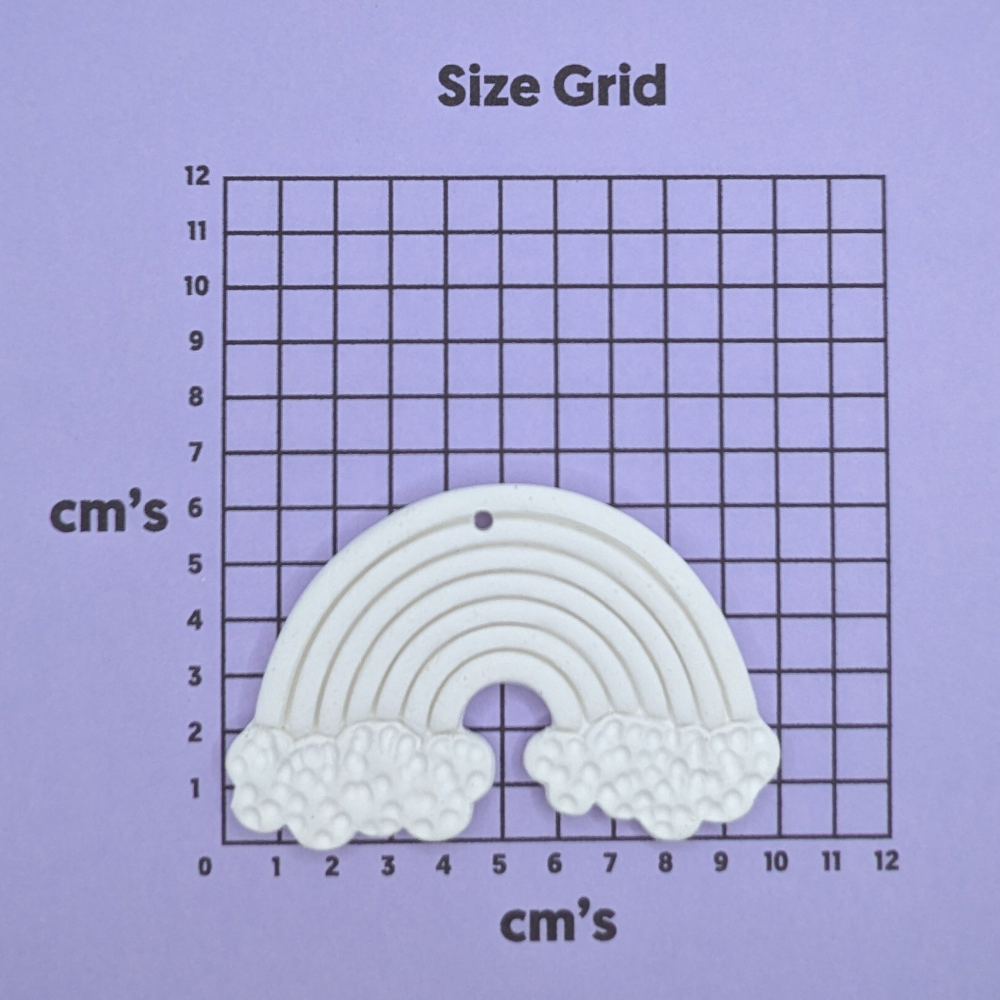 clay rainbow decoration on a size grid with measurements in centimeters 
