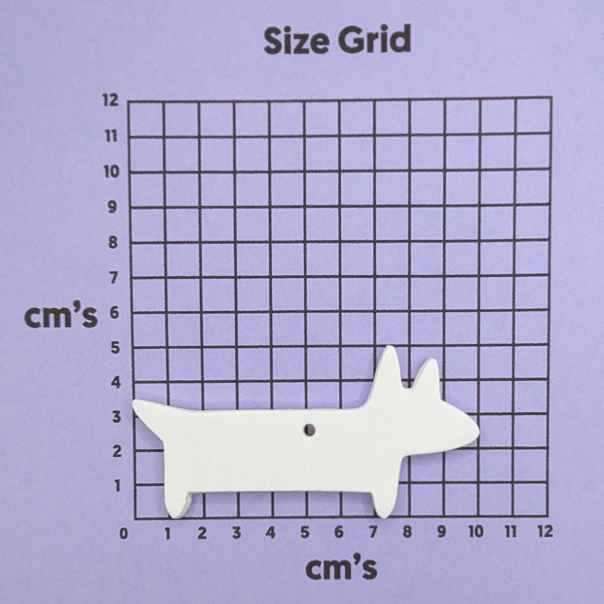 white clay sausage dog on purple size chart