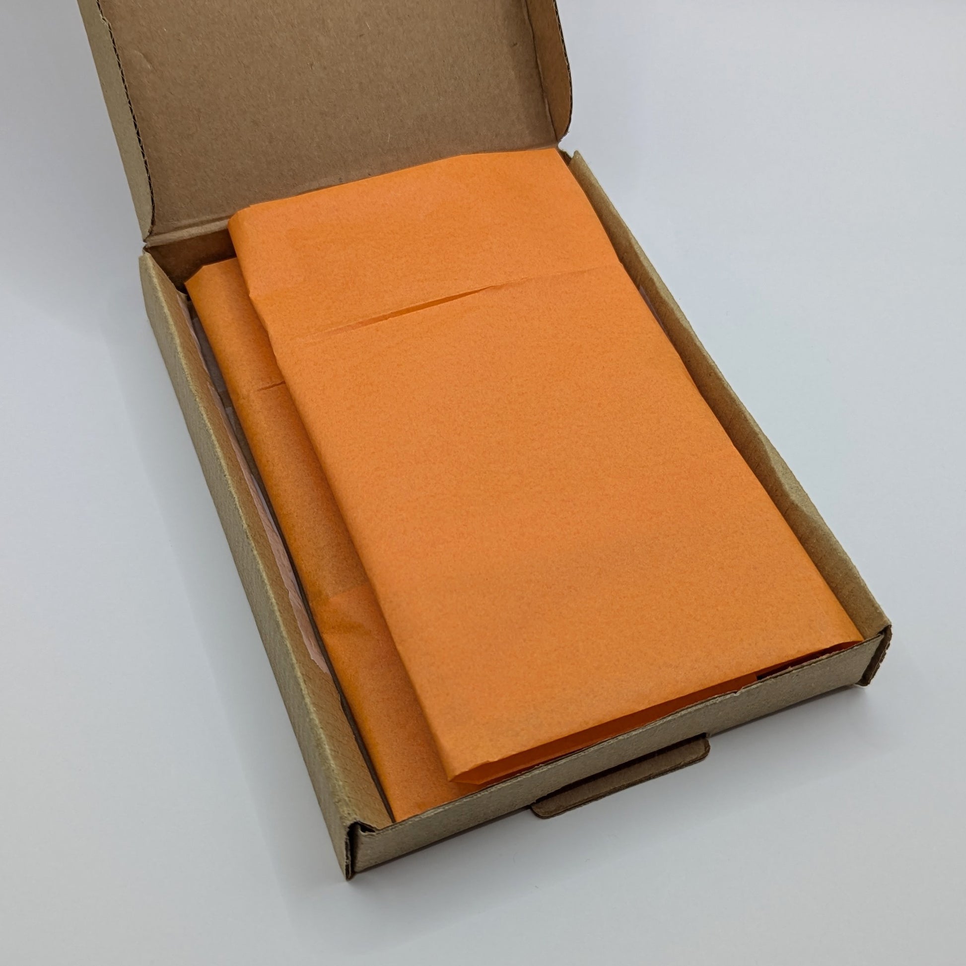 close up of how the box will be packed, kraft box and tissue paper