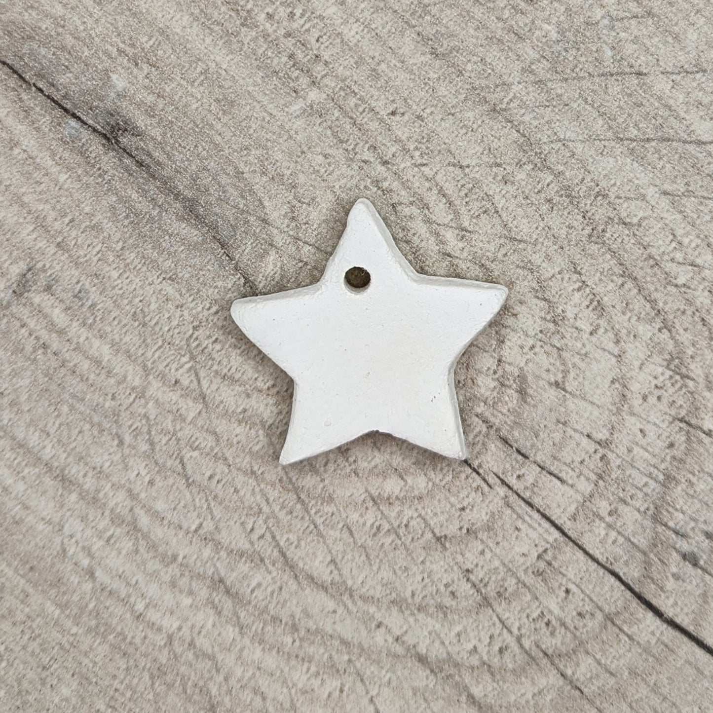 tiny gold start made of white air dried clay
