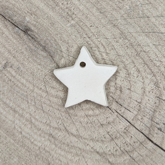 tiny gold start made of white air dried clay