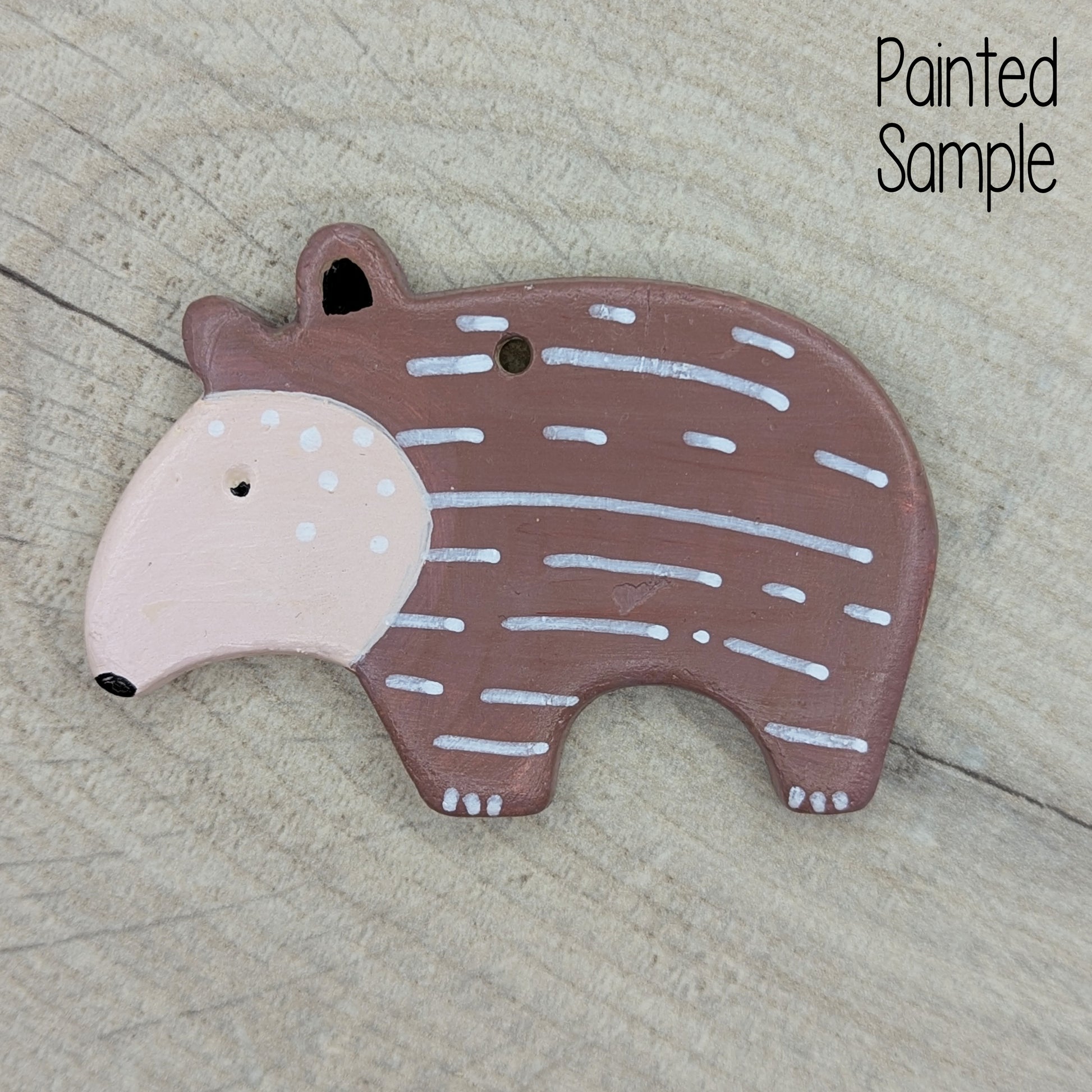 painted baby tapir, in brown and beige, made of air dried clay 