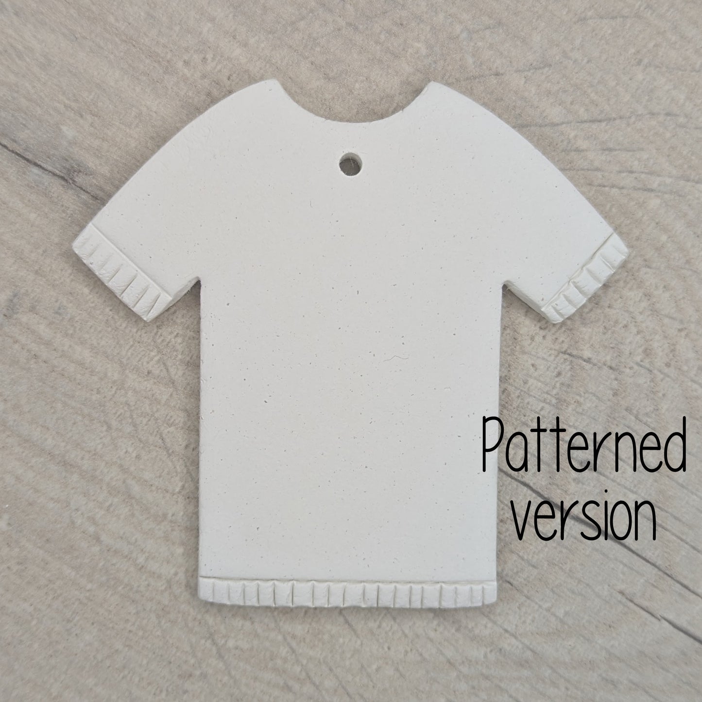 t-shirt clay decoration with detail / pattern around the sleeves and hem area, made of air dried clay