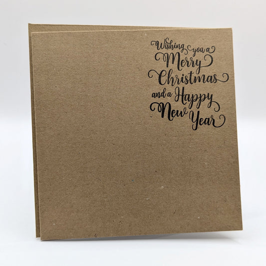 wishing you a merry Christmas and a happy new year, stamped in black ink onto a kraft card, come with matching envelope