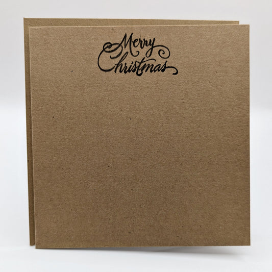 merry Christmas, stamped in black ink onto a kraft card comes with matching envelope